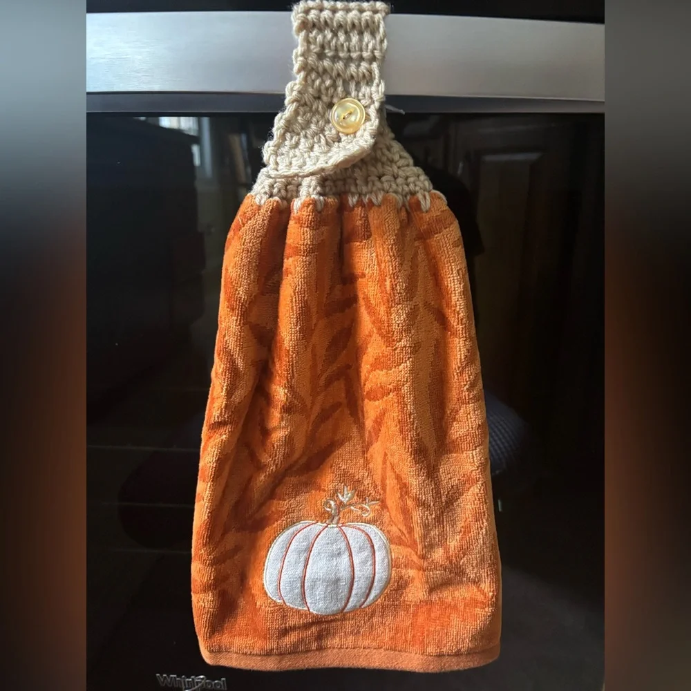 Hand crocheted orange fall towel with embroidered pumpkin